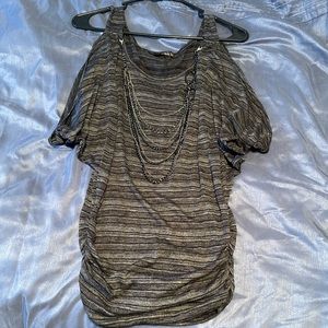 This is a black and gray to that bunches on the sides. Size medium.